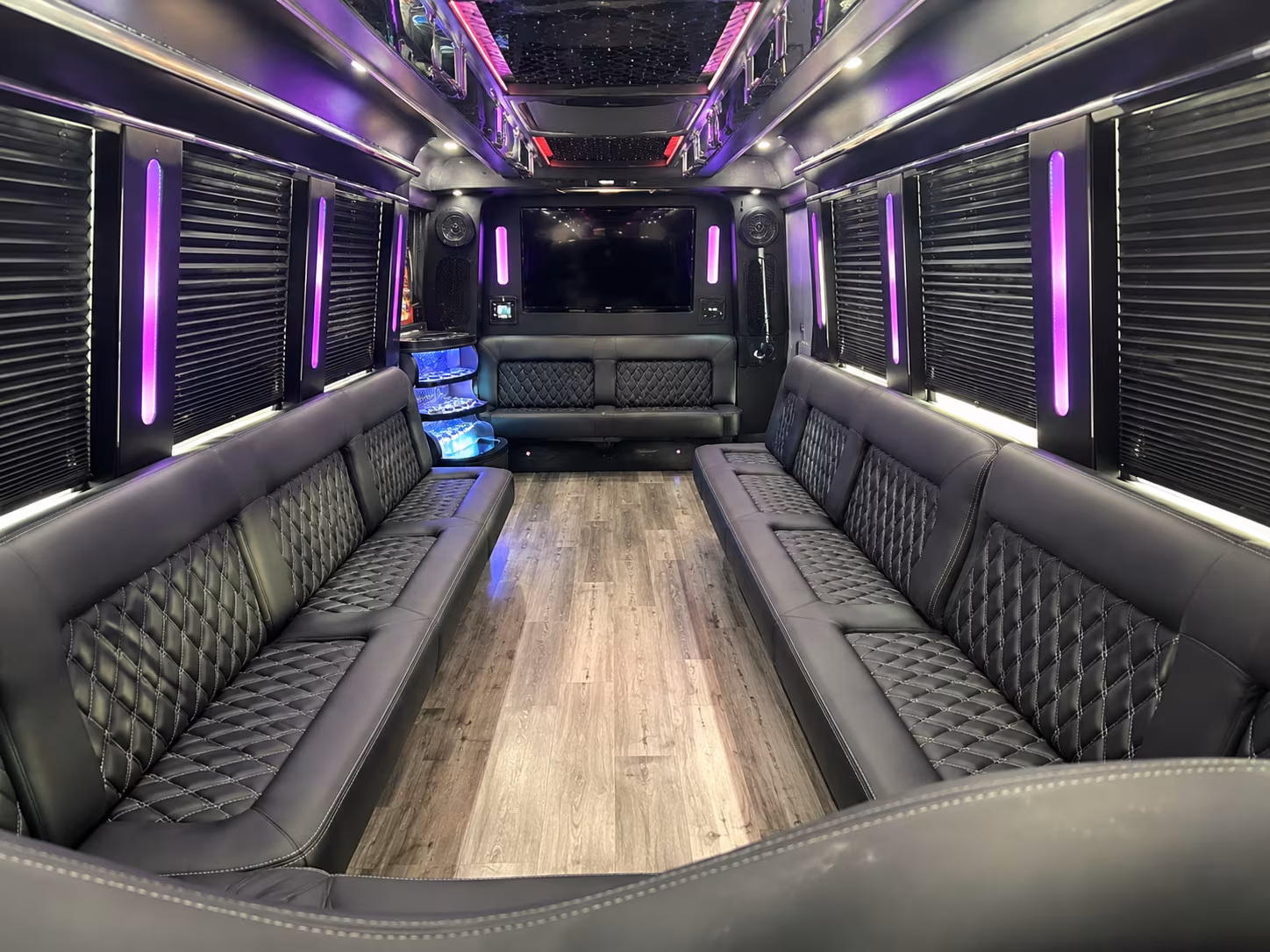 Friends laughing during a party bus celebration in Manhattan