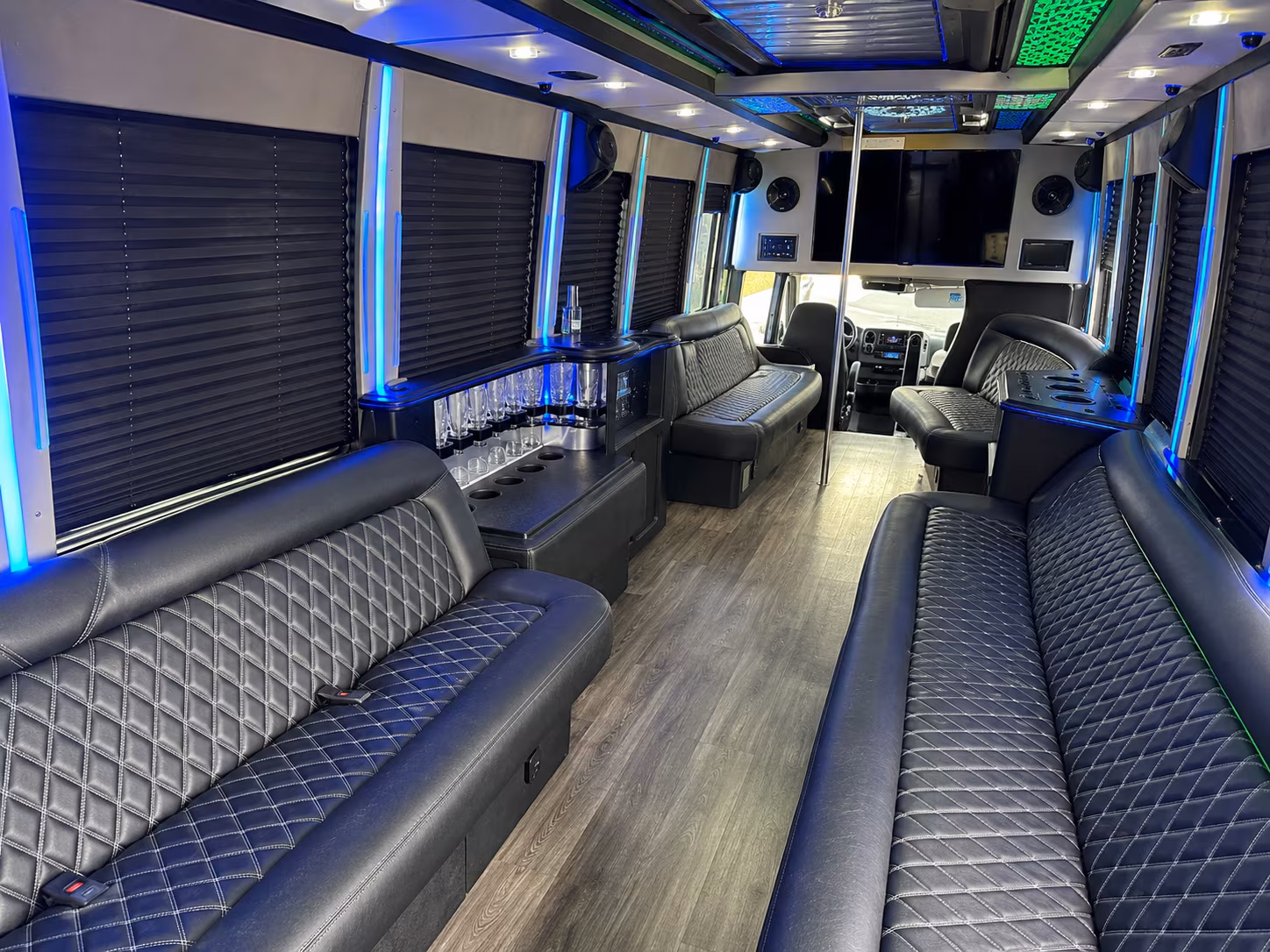 Wedding guests seated inside a party bus serving Manhattan